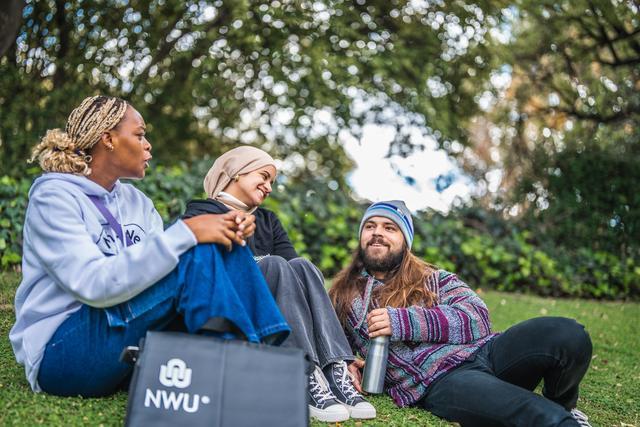 Students sitting on grass