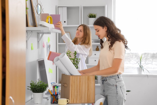 Two girls packing stationary