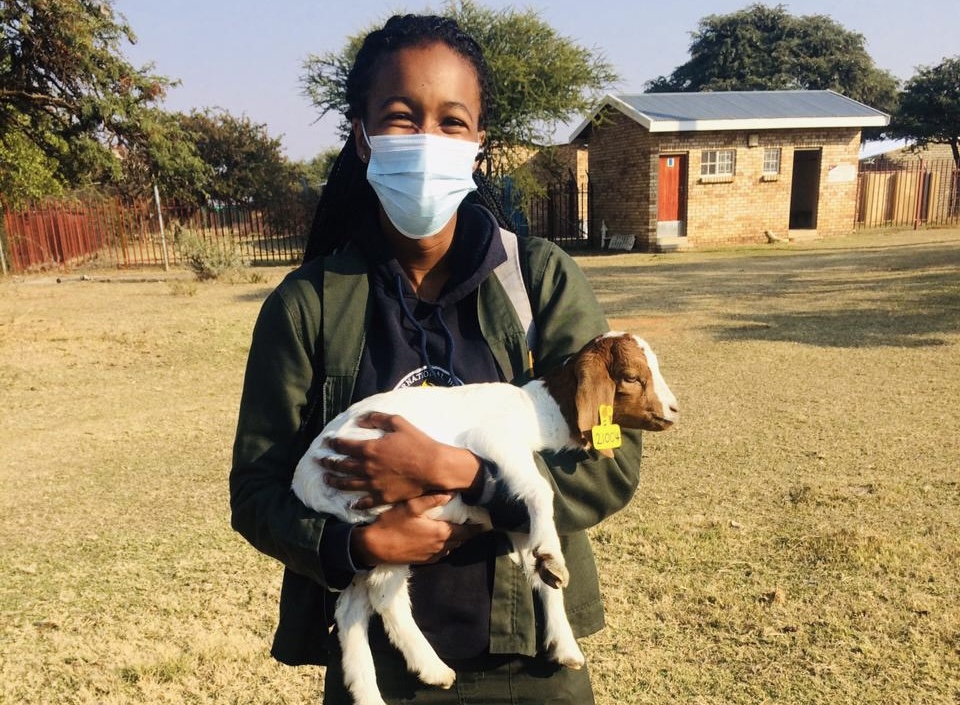 Khutso Carrying a goat