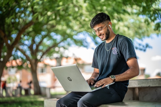 Male looking at laptop