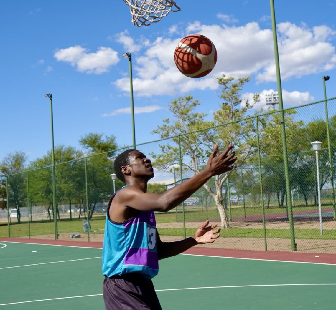 Tonderai throwing ball in the air
