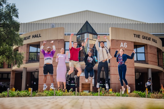 Group of students jumping for joy
