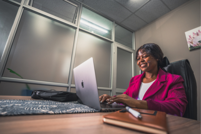 Girl working on laptop in an office
