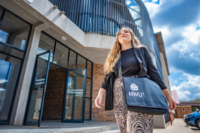 White female walking across campus feeling inspired