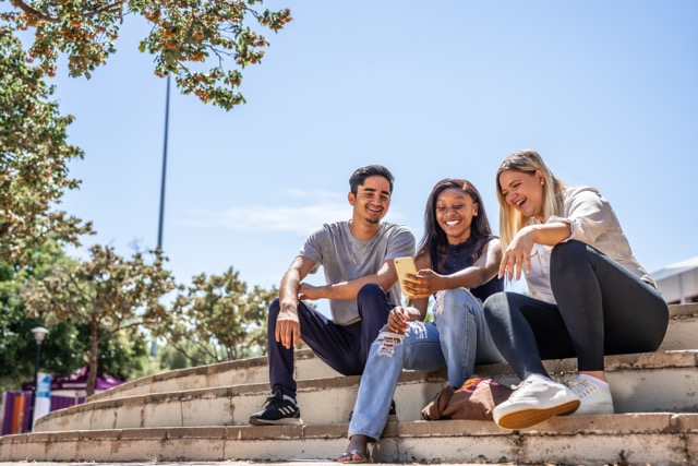 Students sitting on campus steps