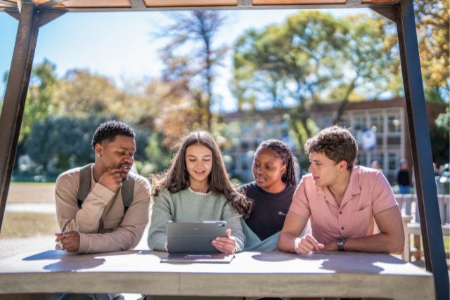 NWU students reading through prospectus