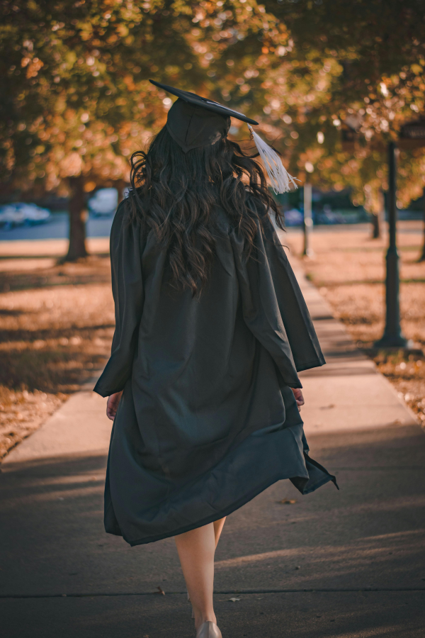 student graduating after receiving postgraduate funding