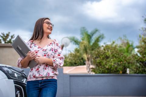 UDL female carrying a laptop