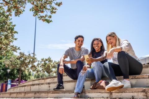 Students sitting on campus steps