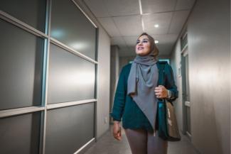 Female wearing hijab looking into her NWU postgrad future